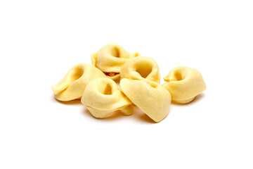 Tortellini stuffed pasta isolated on white background, closeup. Tortellini with raw prosciutto. Italian food