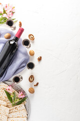 a vertical festive background of the Jewish Passover with a copy space. a bottle of red wine,...