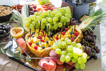 catering buffet table. Lots of tasty fruits and berries.