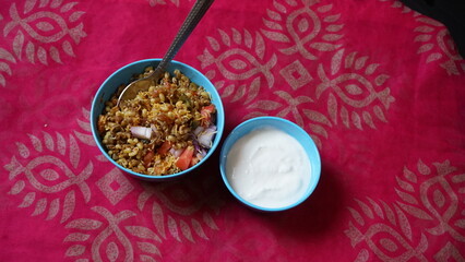 Spicy Misal Pav or usal Pav is a traditional and popular snack or Chat food from Maharashtra, India. Served with chopped onion, lemon wedges and farsan.Selective focus with copy space