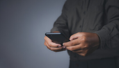 Businessman using smartphone.