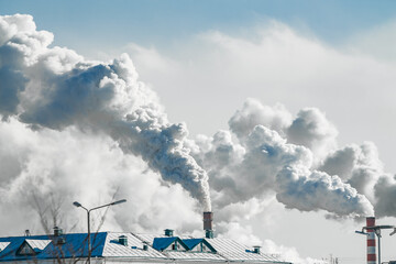 Fototapeta na wymiar industrial chimneys with heavy smoke causing air pollution