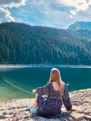 Beauty of nature and person, A girl with Amaizing view on Durmitor lake and mountains, National...