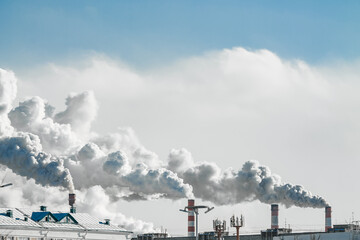 industrial chimneys with heavy smoke causing air pollution