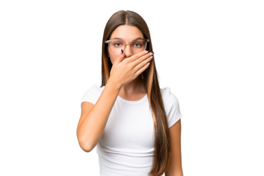 Teenager caucasian girl over isolated background covering mouth with hand