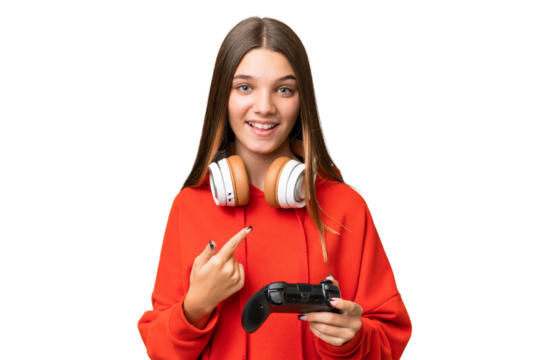 Teenager caucasian girl playing with a video game controller over isolated background with surprise facial expression