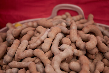 Dried ripe sweet tamarind fruit in the market
