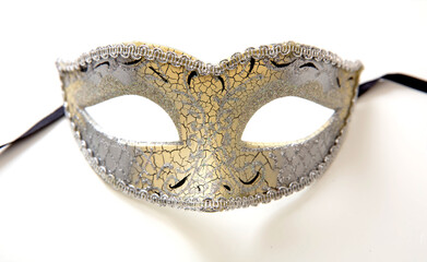 Venetian mask golden and silver glitter decoration isolated on white