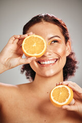 Orange, beauty and woman face in studio with a smile for natural skin glow, cosmetic and...