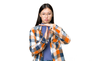 Young Asian woman over isolated chroma key background making time out gesture