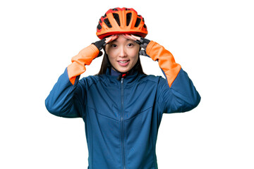 Young cyclist woman over isolated chroma key background with surprise expression