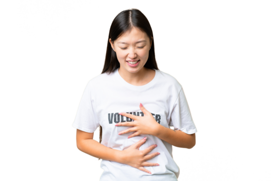 Young volunteer woman over isolated chroma key background smiling a lot