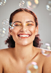 Beauty, bubbles and face of woman with a smile in studio for skincare cosmetics, skin glow and...