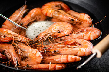 The shrimp are cooked in a pot of water. 