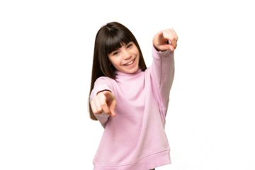 Little girl over isolated green chroma key background pointing front with happy expression