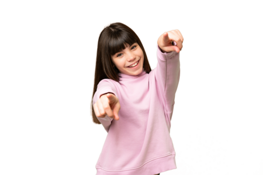 Little girl over isolated green chroma key background pointing front with happy expression