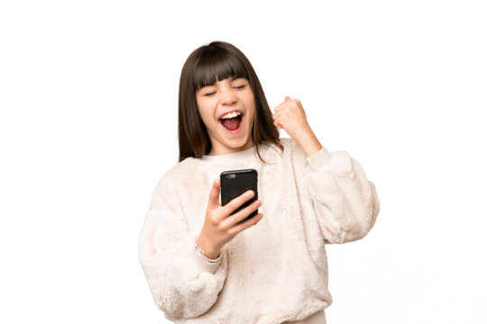 Little girl over isolated green chroma key background with phone in victory position