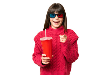 Naklejka premium Little girl holding soda over isolated chroma key background surprised and pointing front