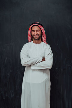 Portrait of young muslim man wearing traditional clothes