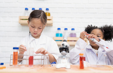 Elementary School Science student have fun playing biochemistry research in chemistry class room