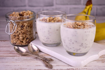 Banana chiapudding with granola. Healthy snack.
