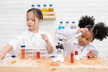 Elementary School Science student have fun playing biochemistry research in chemistry class room