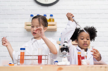 Elementary School Science student have fun playing biochemistry research in chemistry class room