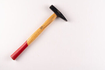 Selective focus top view of standard hammer with text area isolated on white background.