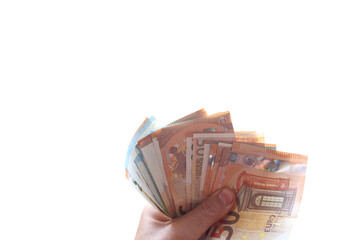 Hand holds some money banknotes, concept of economic wealth and success