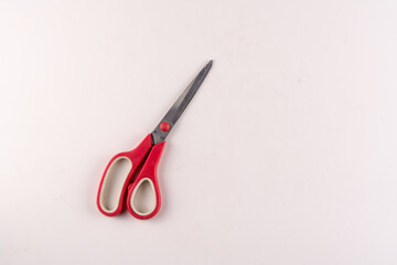 Top view of scissors on isolated white background studio shoot with text area.