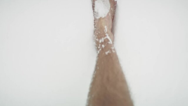 Caucasian man walking barefoot in snow POV. Shot with RED helium camera in 8K.     