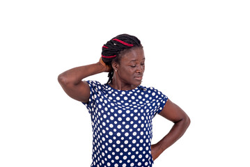 Portrait of young woman standing with hand on back of neck.