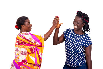 two beautiful women clapping palm together smiling.