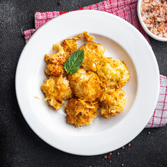 cauliflower with cheese baked vegetables healthy meal food snack on the table copy space food background rustic top view keto or paleo diet veggie vegan or vegetarian food
