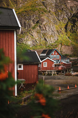 Typical red wooden houses at the harbor, on the Lofoten Islands in Norway - during an beautiful autumn day