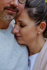 Portrait of happy couple in love,standing in forest.