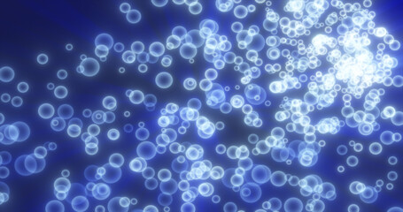 Abstract flying small round blue glowing bright bokeh particles, bubbles and glare shiny energetic magical glowing on a dark background. Abstract background