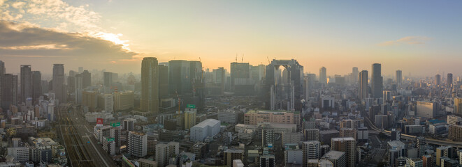 Osaka, Japan - January 7, 2023: Atmospheric haze over downtown Umeda at sunrise - 563954232