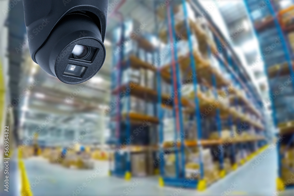 Poster closed circuit camera multi-angle cctv system against the background of a modern warehouse complex. 