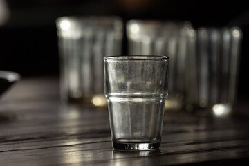 An old, historic, soviet time glasses on the table. Indoors photo of drinks in glasses.