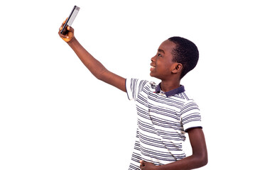 portrait of a young boy with cellphone, smiling.