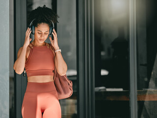 Fitness, walking and black woman listen to music, relax podcast or radio for calm, stress relief or...