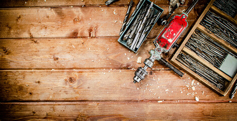 Hand drill with various drills.