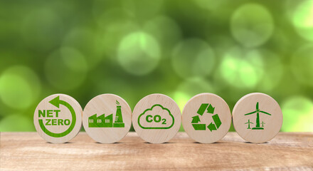 NET ZERO air pollution reduction concept to reduce global warming, round wooden table top with...