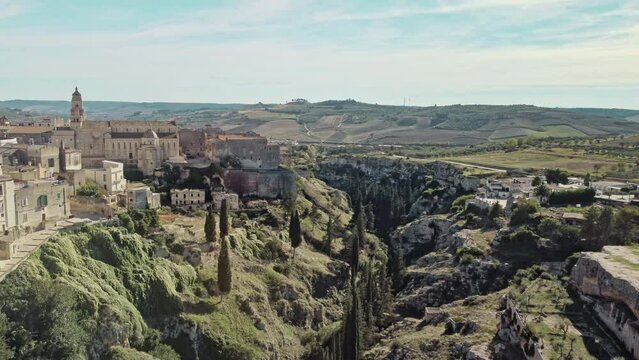 Canyon of Gravina with the old aqueduct stone bridge. Apulia region, Italy