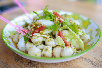 Boiled fish balls and vegetable with Seafood Sauce. Thai food style.