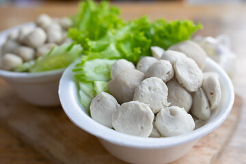 Boiled fish balls and vegetable with Seafood Sauce. Thai food style.