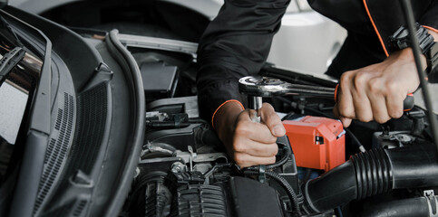 Fototapeta na wymiar Mechanic fixing a car at home. Repair and service.