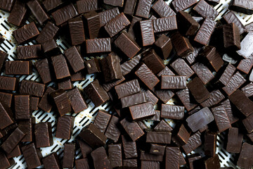 Production of chocolate candy. Sweets on conveyor belt at factory