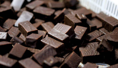 Production of chocolate candy. Sweets on conveyor belt at factory